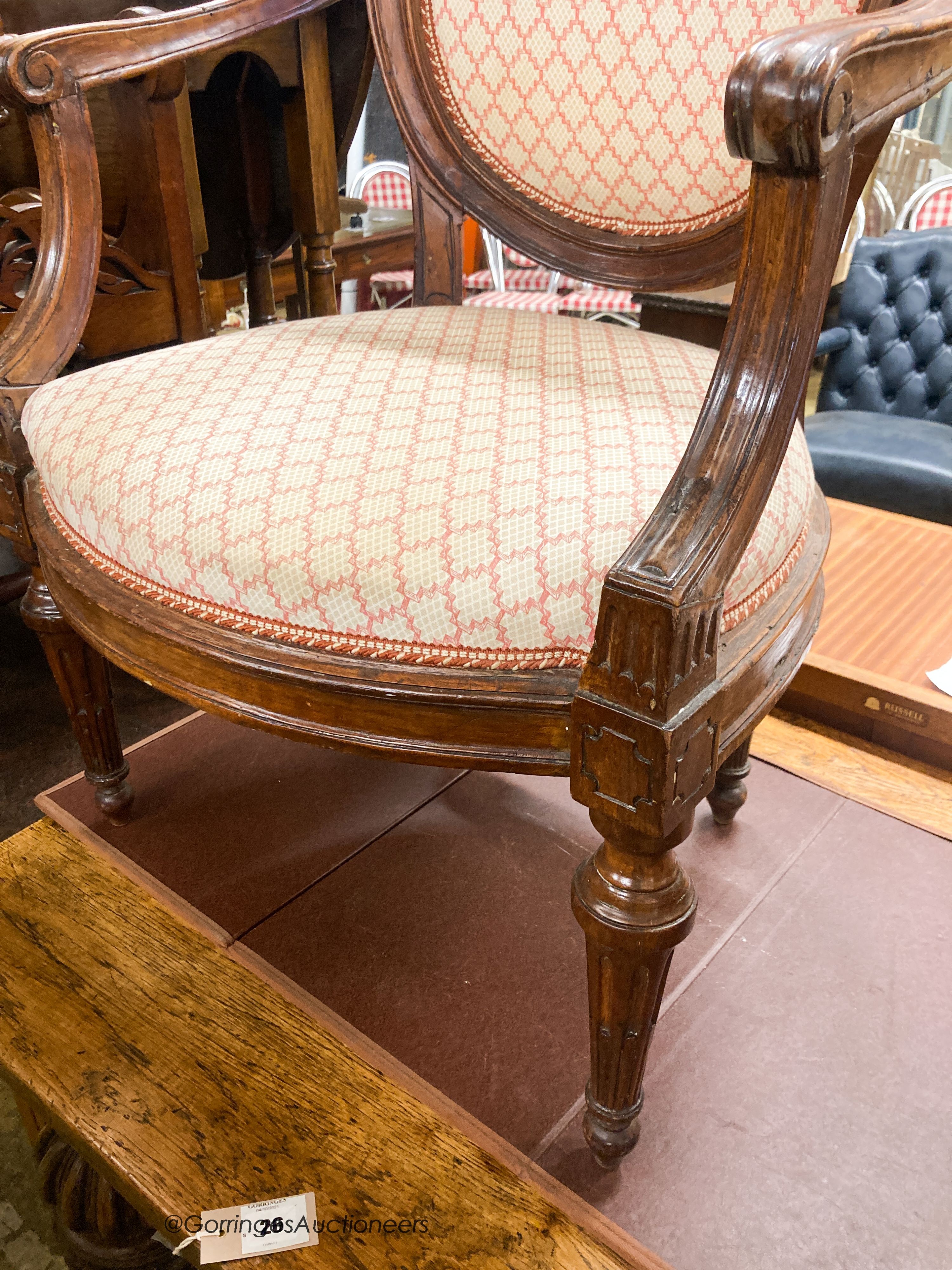 A pair of 19th century French walnut upholstered elbow chairs, W.62cm D.50cm H.102cm